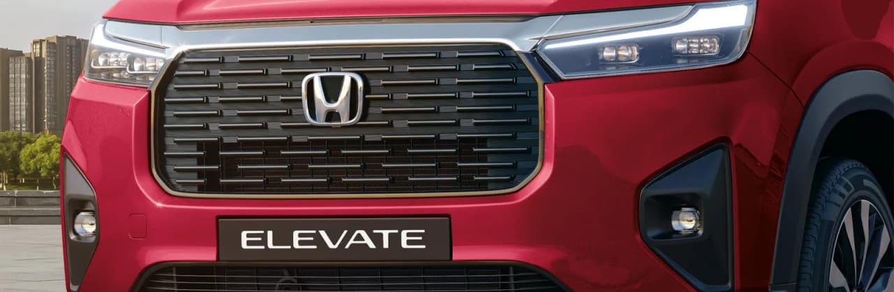 Front view of a Honda Elevate SUV showcasing the grille and headlights.