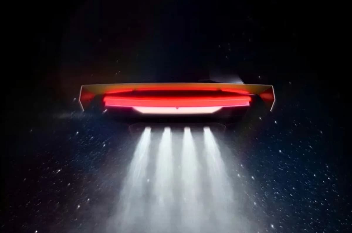Rear view of a Tesla Roadster with active rear wing and thrusters.